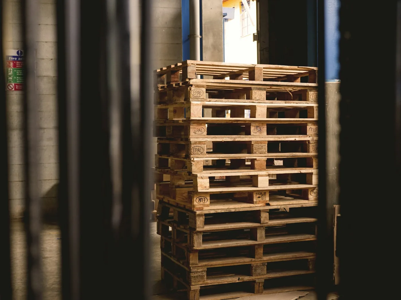 Wooden pallets stacked in a warehouse