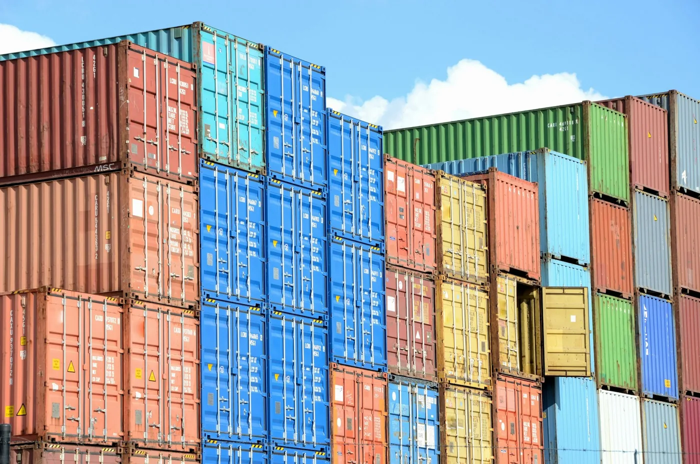 Intermodal containers stacked in colour
