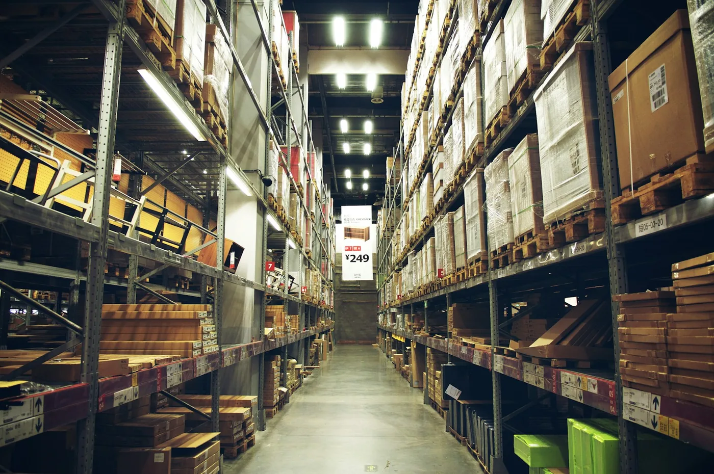 A warehouse aisle stacked with boxed goods