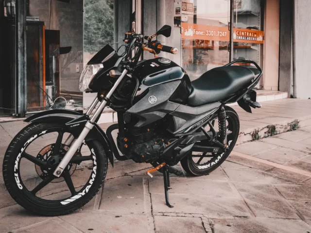 A small motorcycle parked on a street