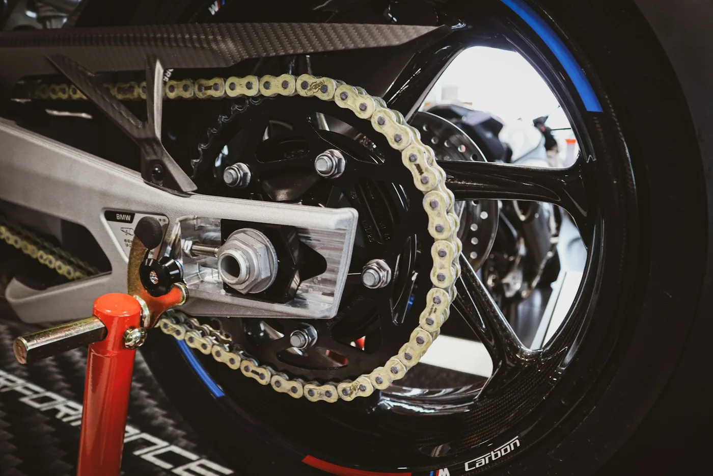 Close-up of a motorcycle's rear wheel and chain