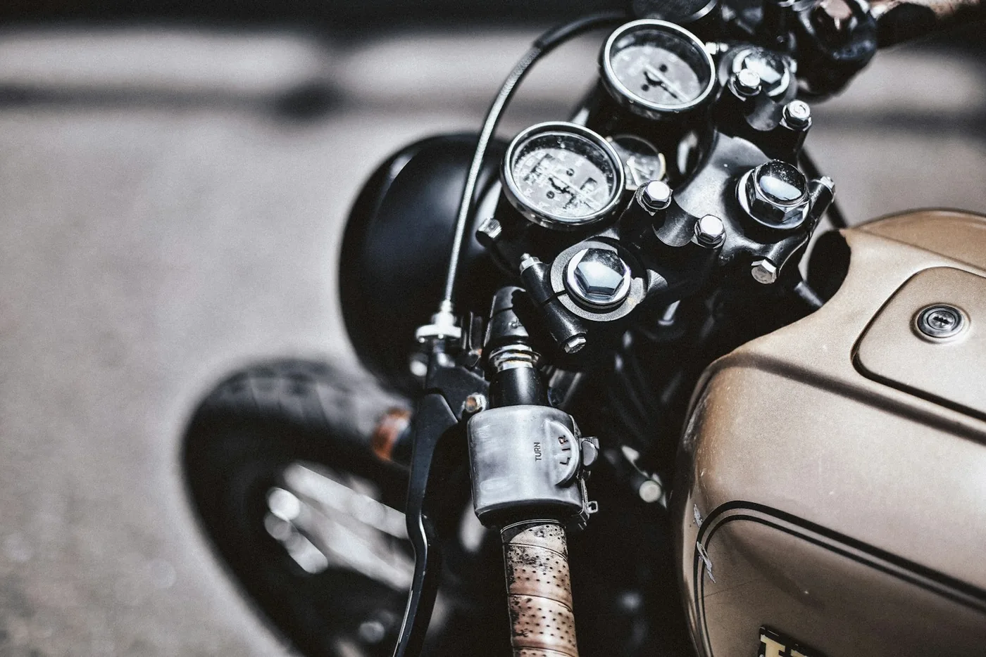 a close up of a motorcycle parked on the street