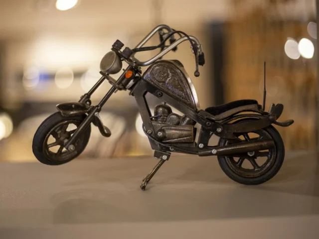 black motorcycle scale model on white table