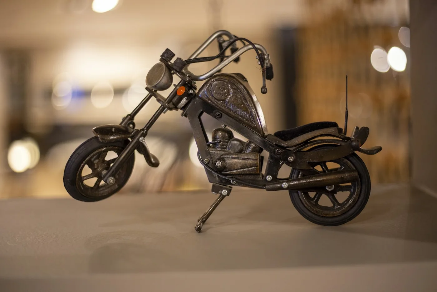 black motorcycle scale model on white table