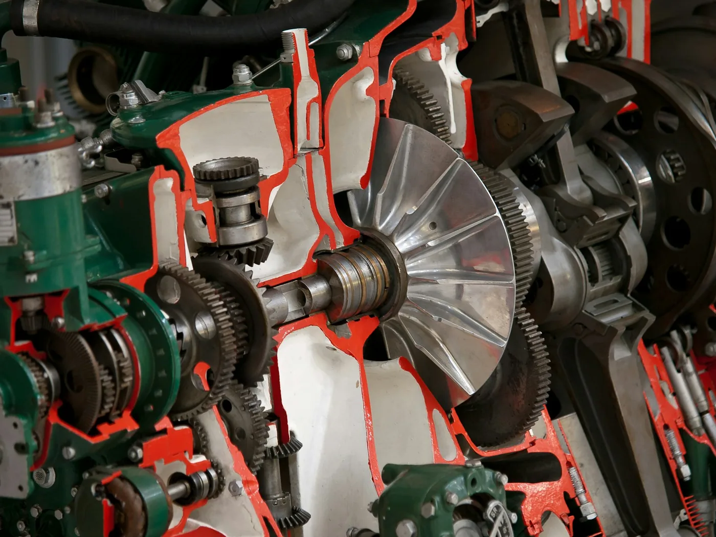 A sectioned engine cutaway showing its gears and shafts