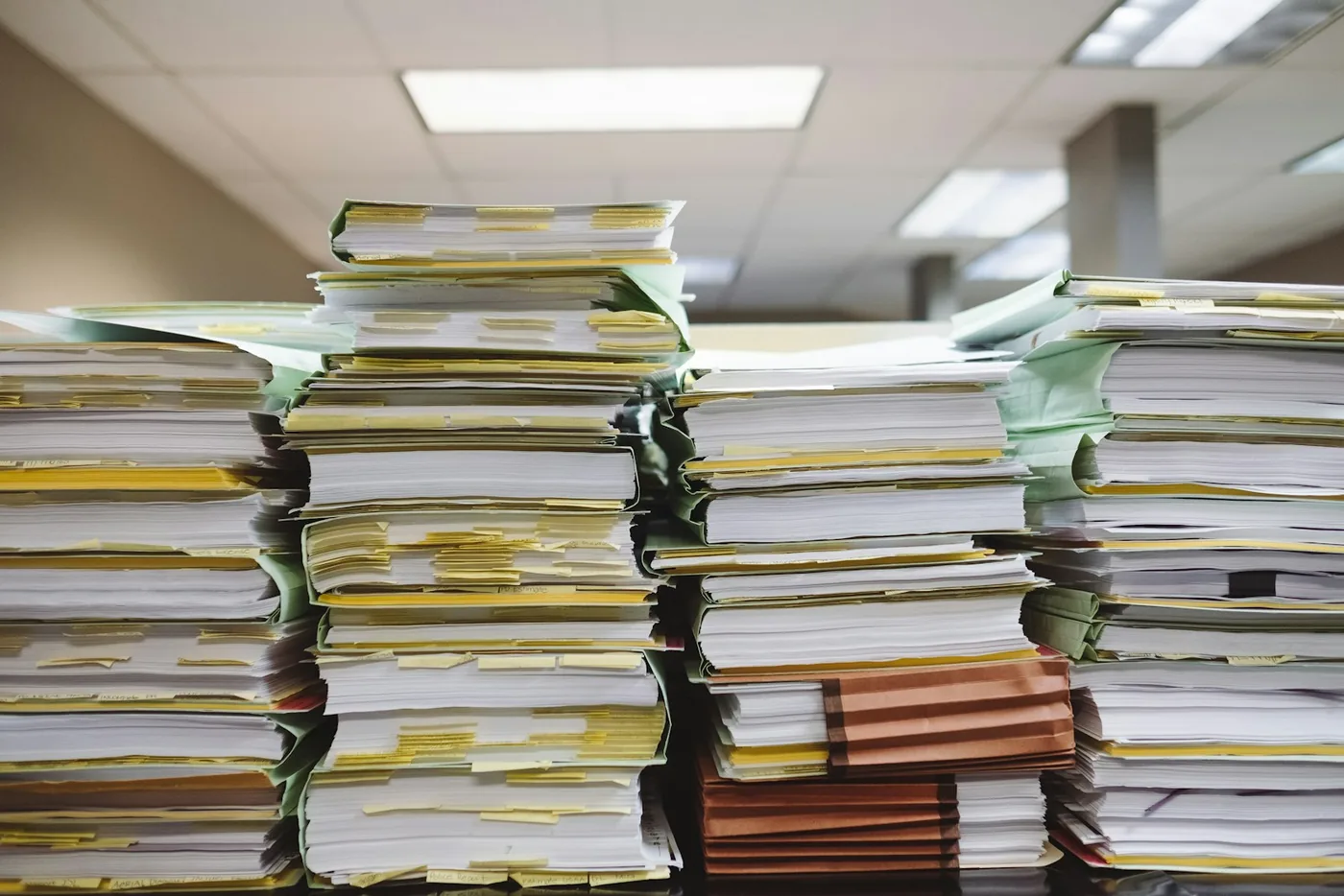 Stacks of paper documents and files