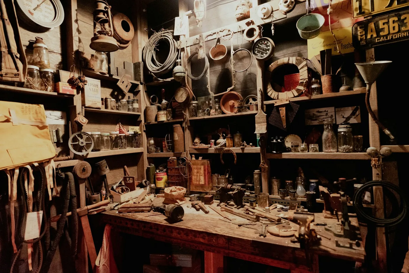 A workshop bench crowded with parts and tools
