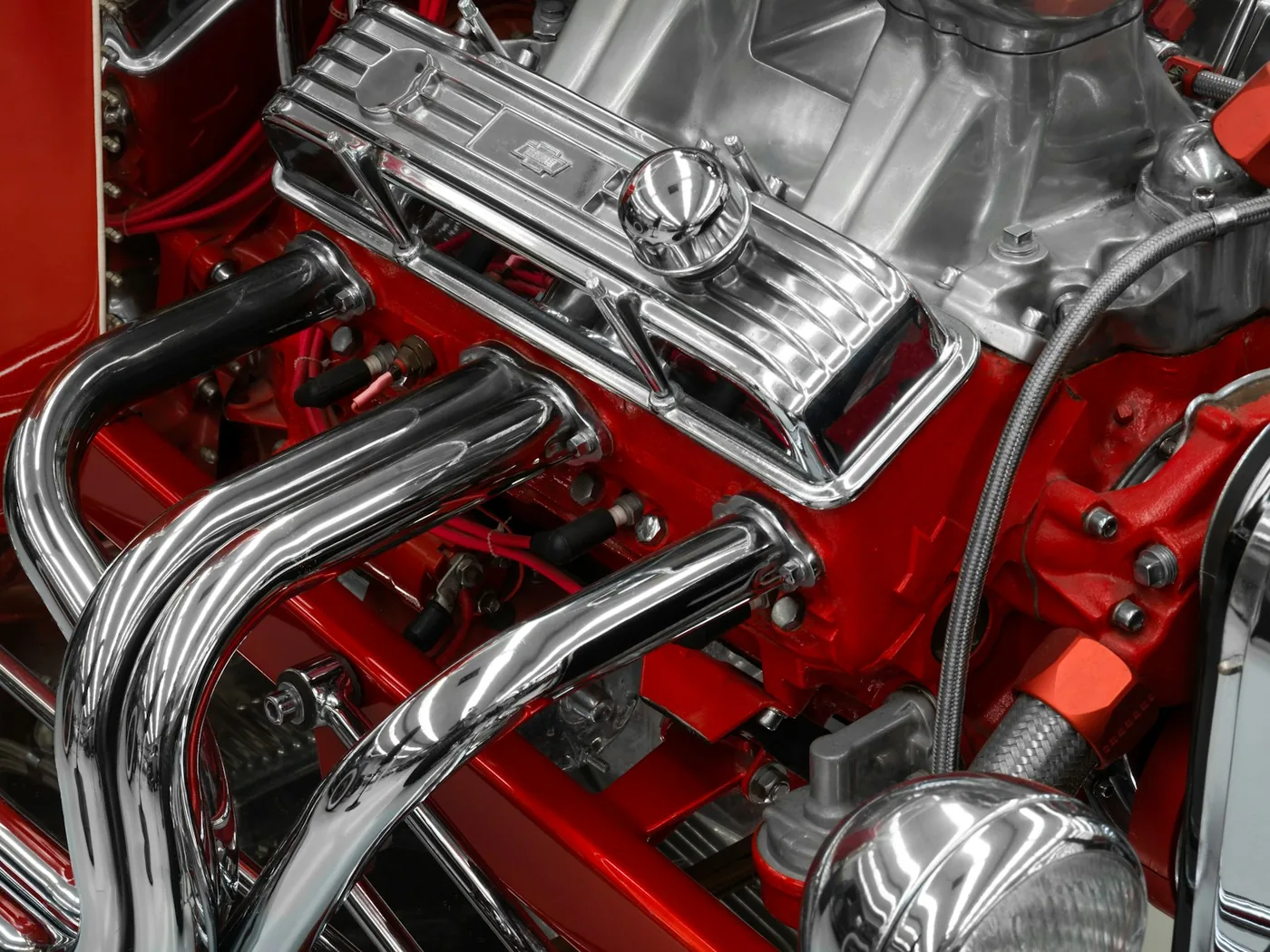 A chrome-piped engine finished in red