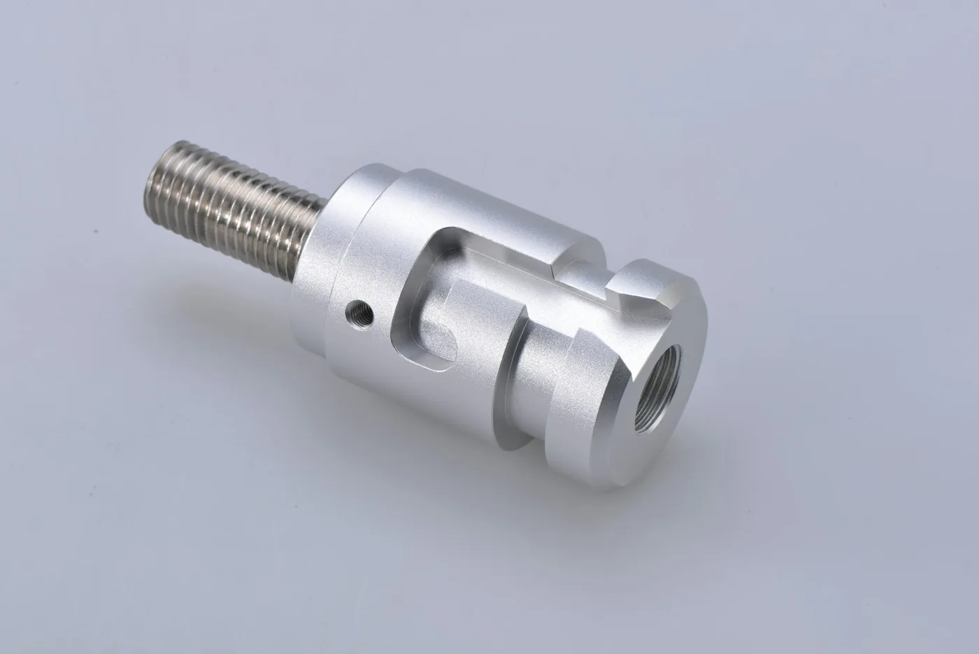 A machined cable end fitting