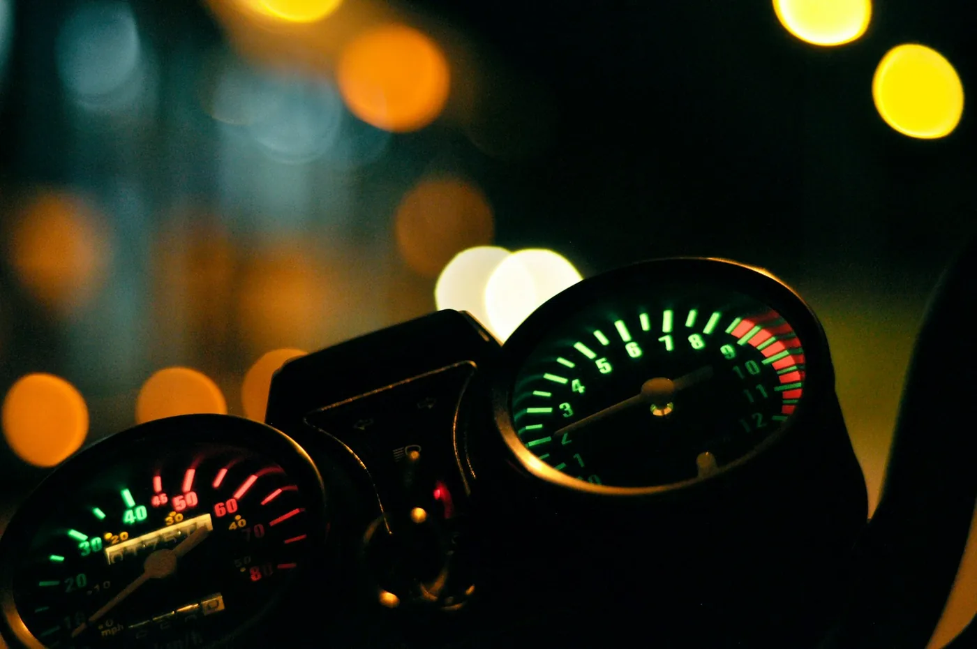 A motorcycle speedometer in the dark