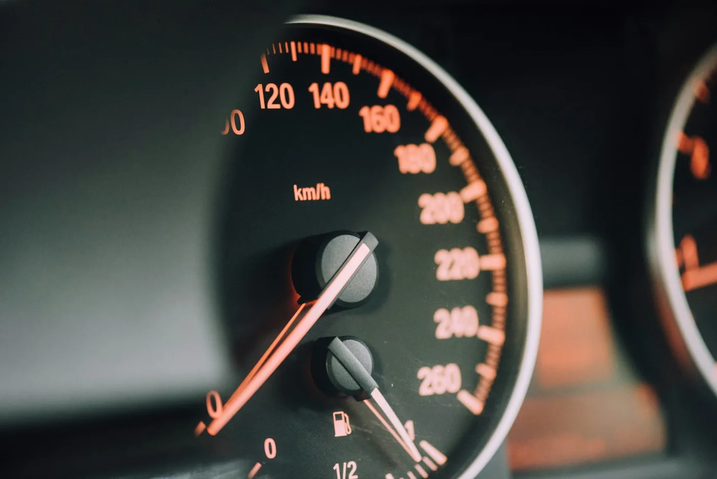 A speedometer face marked in kilometres per hour