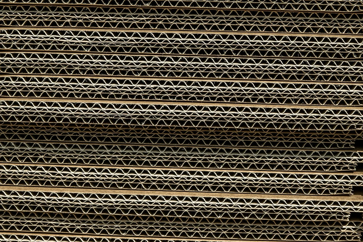 The corrugated edge of stacked cardboard