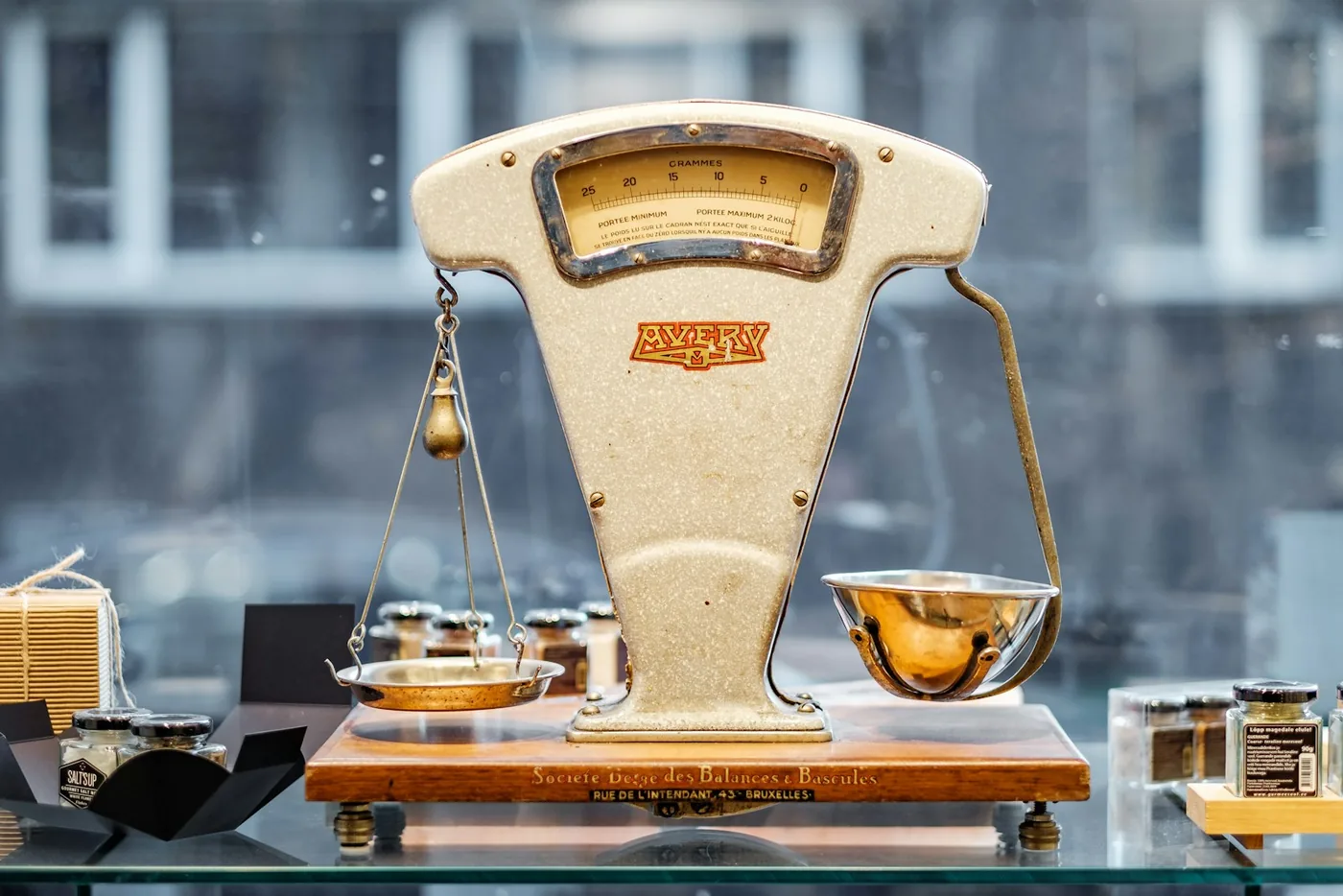 A weighing balance standing on a counter