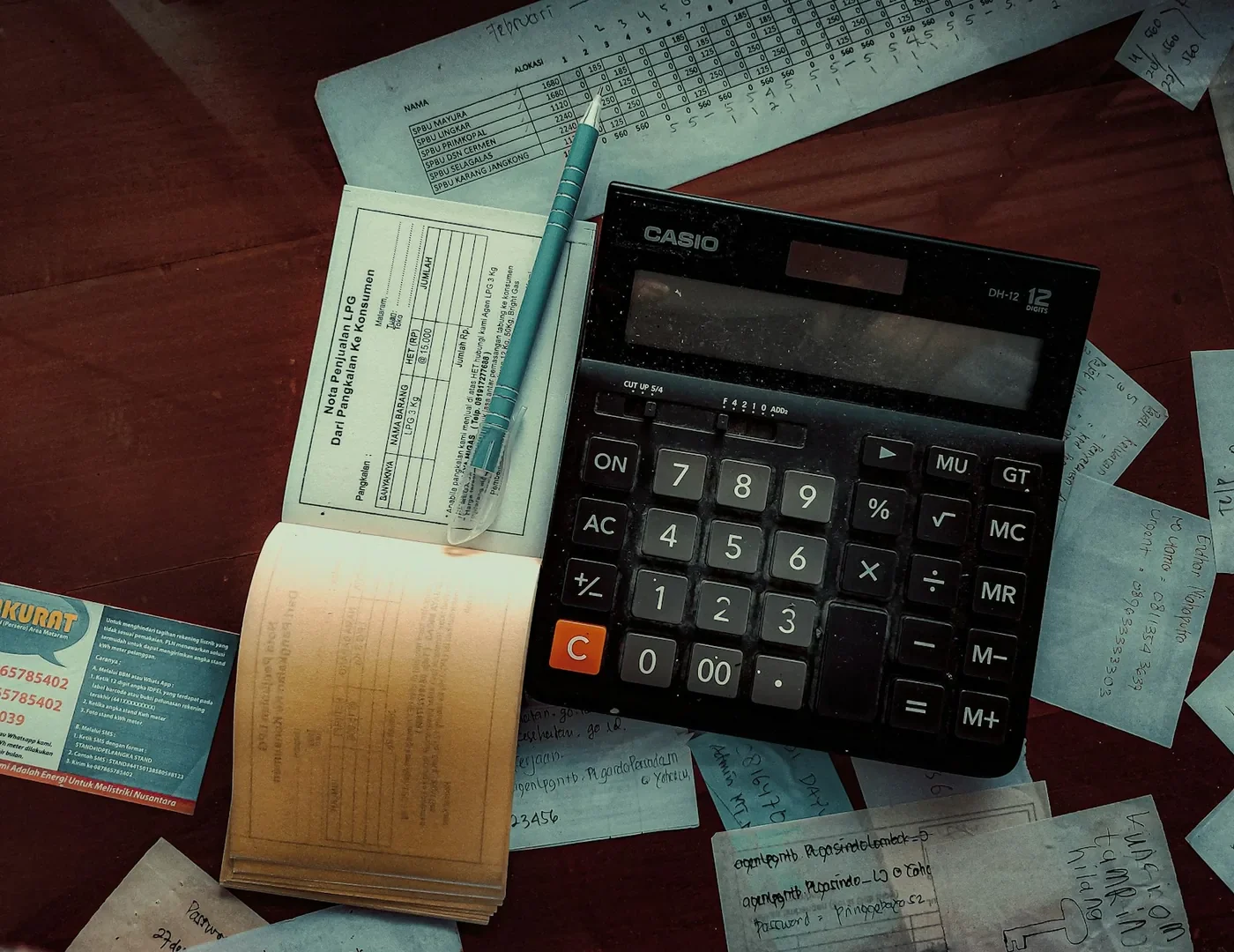A printed quotation and calculator on a desk