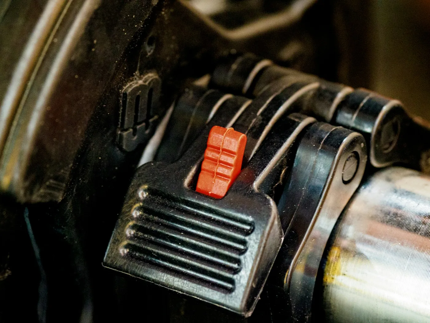 A ribbed foot pedal on a machine