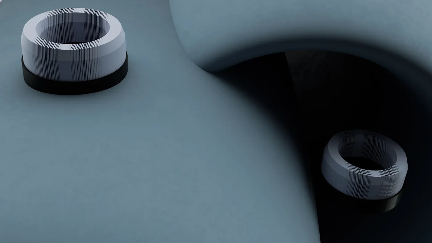 Two metal bushes on a grey surface