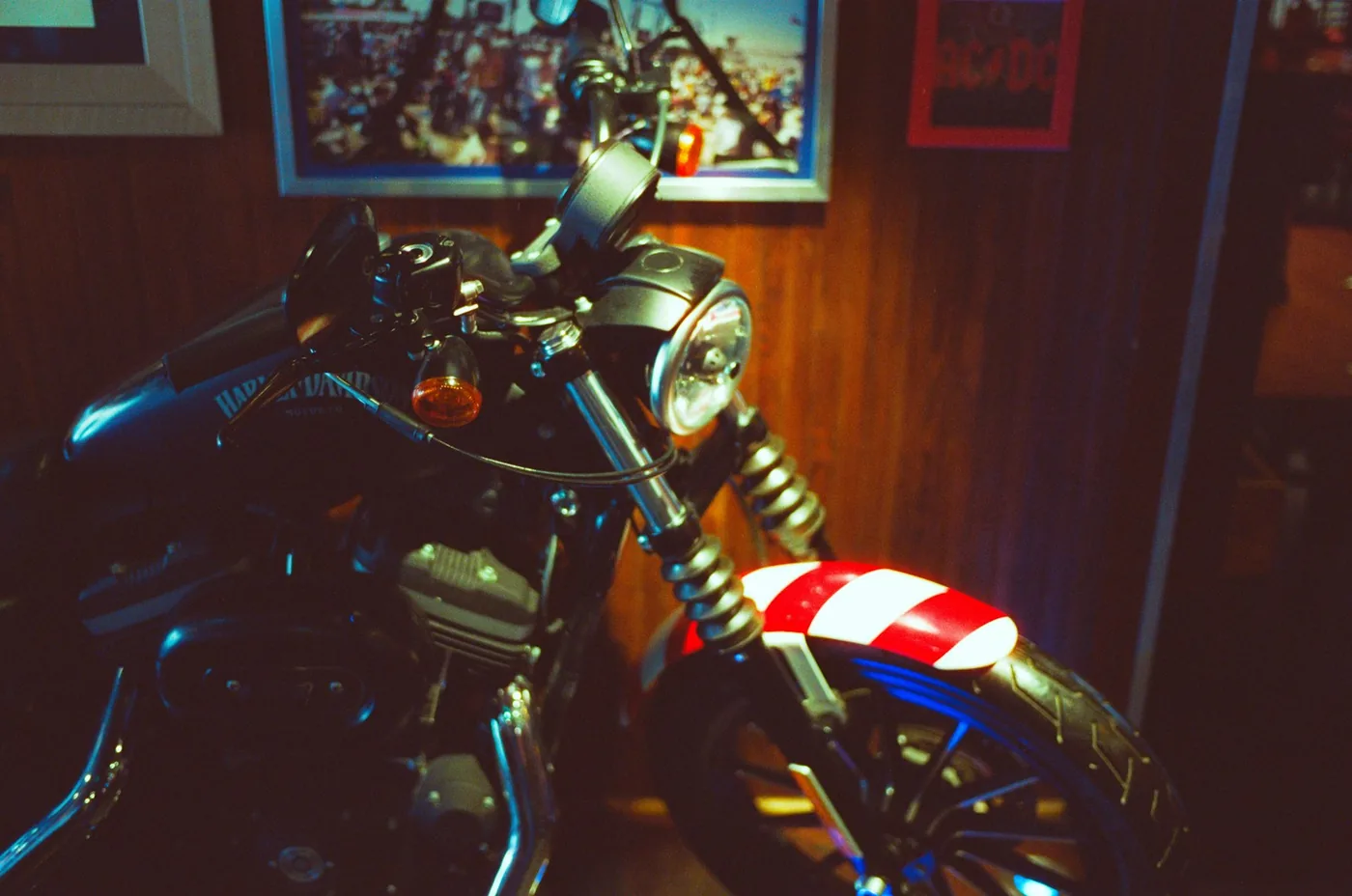 A vintage motorcycle with a red and white stripe