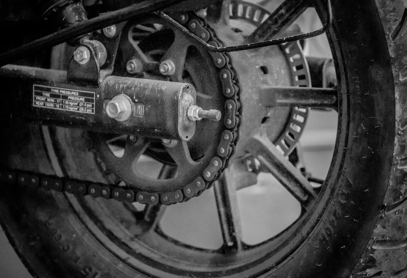 The rear axle and chain adjuster, in black and white