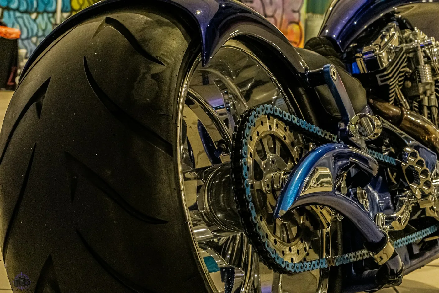 A rear wheel with a coloured drive chain