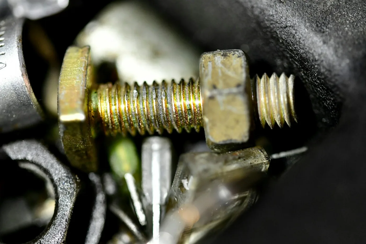A brass screw and nut in close-up