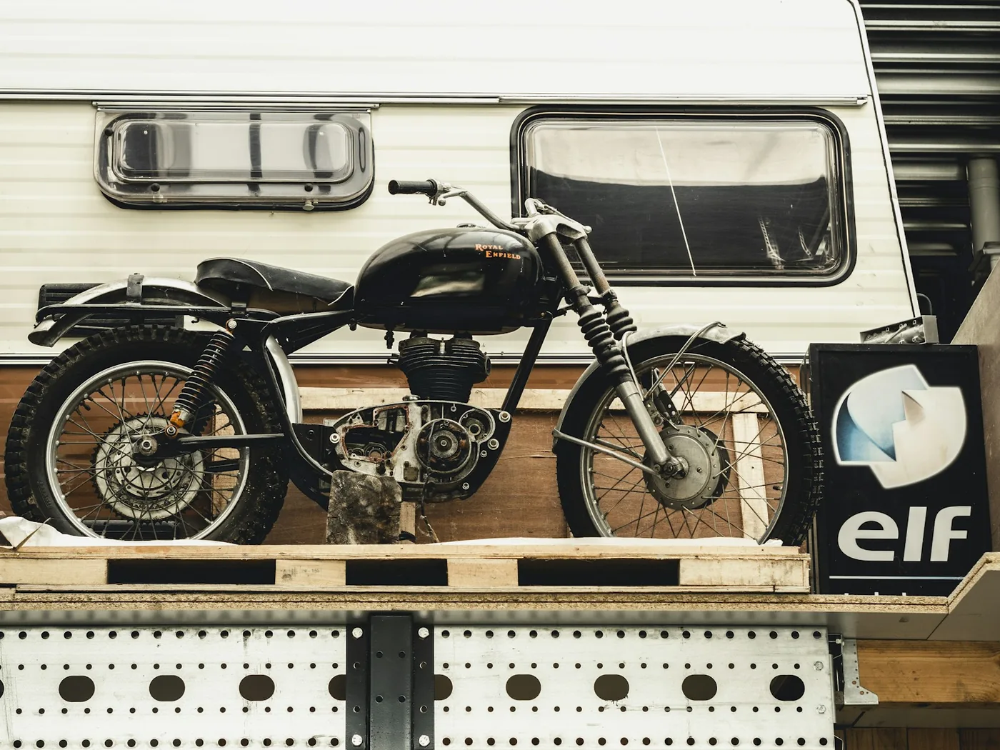 A motorcycle standing on a pallet