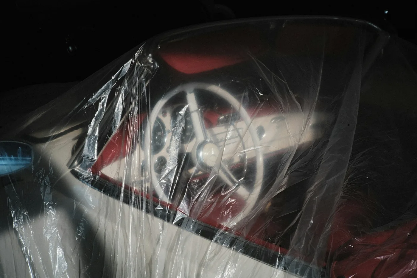 A vehicle wrapped in protective plastic