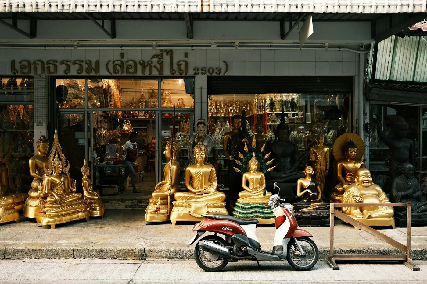 a motor scooter parked in front of a store