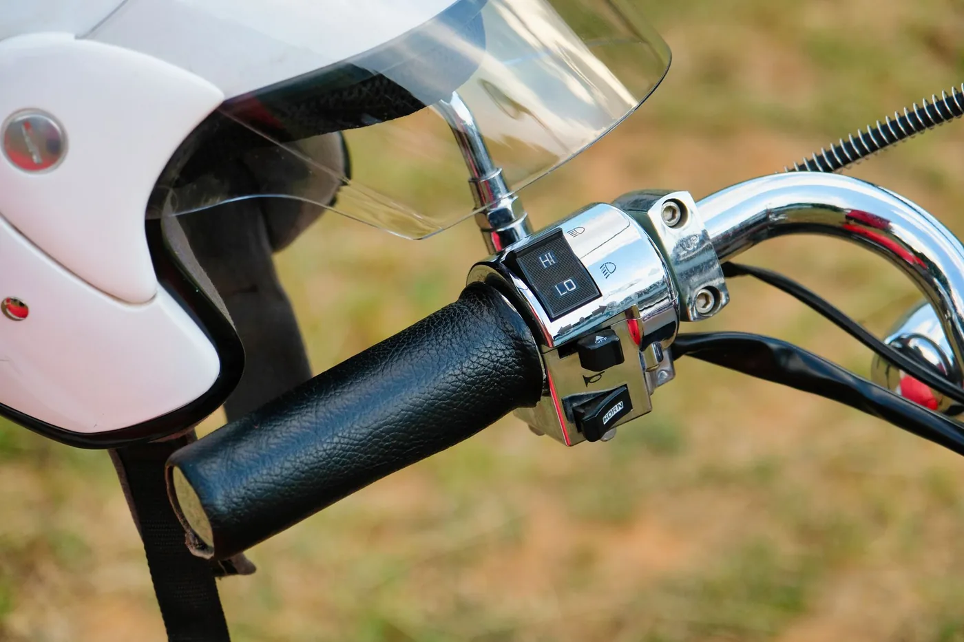 The handlebar and screen of a motorcycle