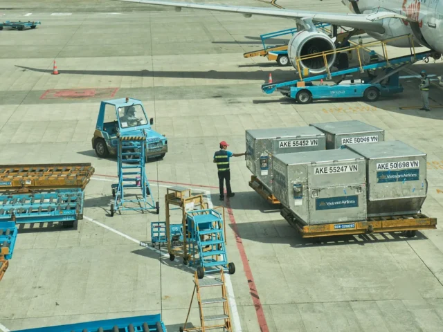 a person standing next to an airplane