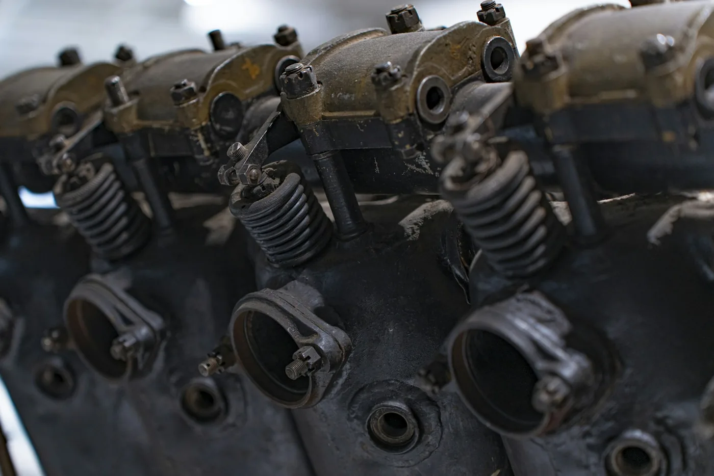 Old engine cylinder heads with their valve springs