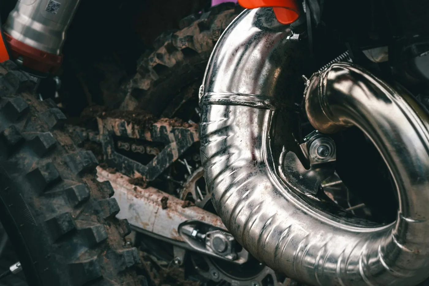 A chrome header pipe running from an engine